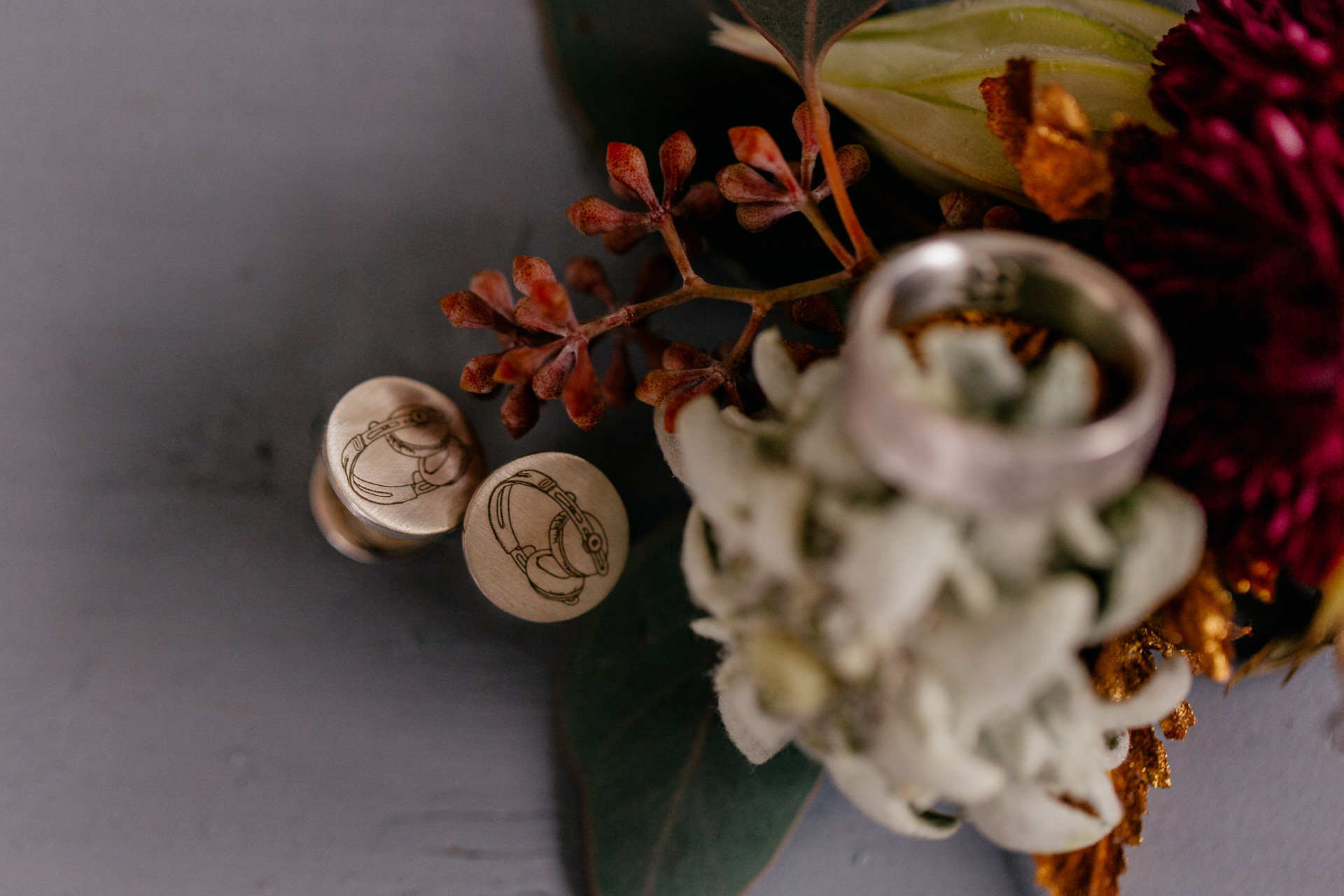 bespoke studs-wedding band-buttonaire flowers-grooms details