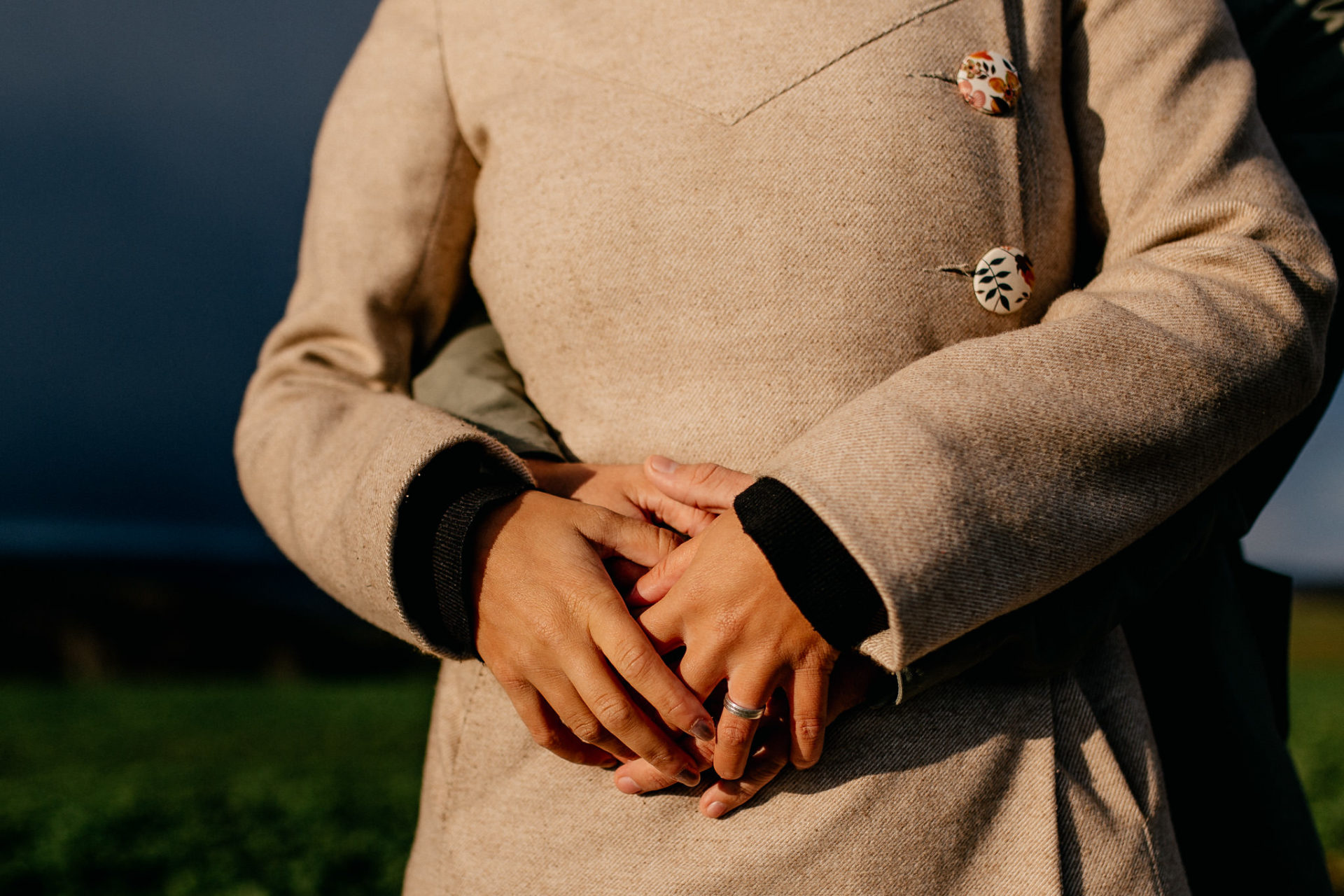 couple shoot detail outfit-engagement session what to wear-vintage girl coat-holding hands-engagement ring