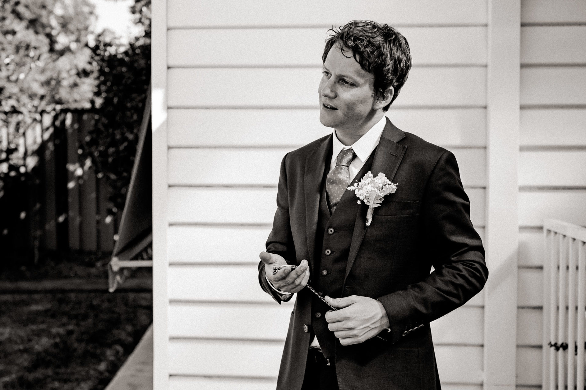 backyard-wedding-australia-melbourne-groom-just-before-first-look-checking-pocket-watch